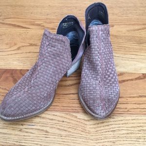 Woven leather ankle bootie.